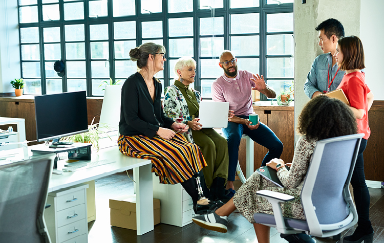 Colleagues chatting in the office