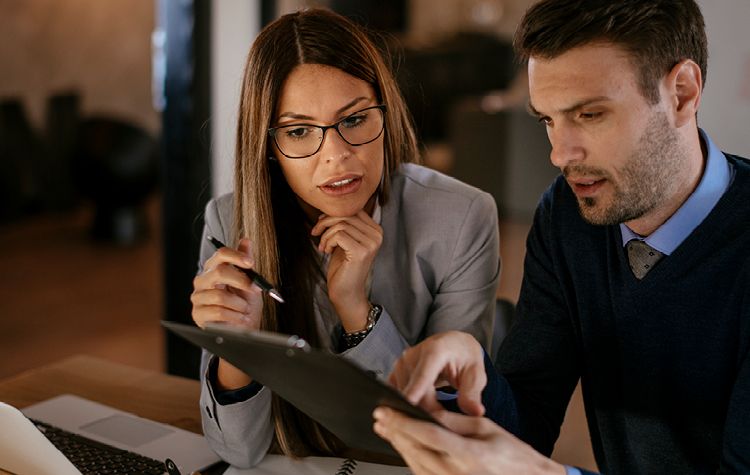 Two sales and marketing professionals working